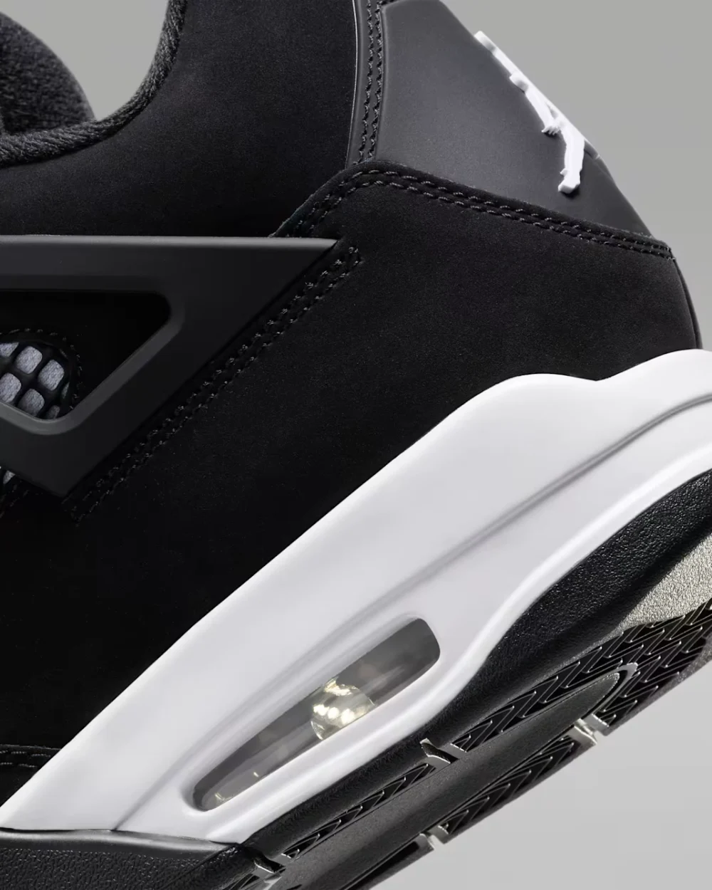 Air Jordan 4 Retro White Thunder Air Jordan 4 Retro White Thunder black nubuck sneaker with white accents