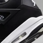 Air Jordan 4 Retro White Thunder black nubuck sneaker with white accents