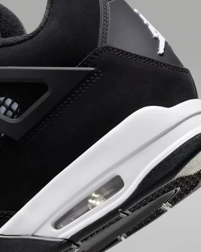 Air Jordan 4 Retro White Thunder black nubuck sneaker with white accents